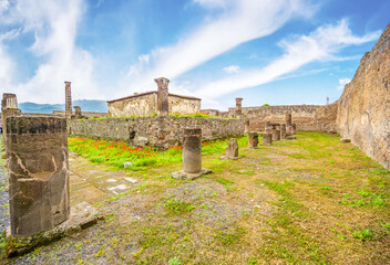 Fototapeta na wymiar Ruins of Pompeii near Naples, Italy. Pompeii is an ancient Roman city. Mount Vesuvius. Panorama of abandoned street in Pompei.