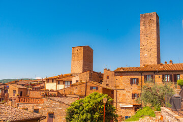 Medieval San Gimignano hill town with skyline of medieval towers, including the stone Torre Grossa. Province of Siena, Tuscany, Italy.