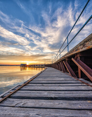 bridge over the sea at sunset