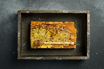 Honeycombs with honey in a wooden frame from a beehive. Natural honey. Top view.
