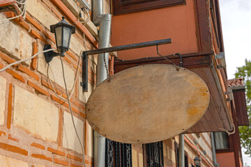 Oval Wooden Board Hanging at Old Building in Turkey