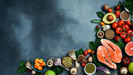 Top view. Healthy food selection on gray background. Detox and clean diet concept. Foods high in vitamins, minerals and antioxidants. Anti-aging foods. - 788117565