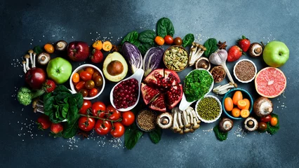  Healthy eating ingredients: fresh vegetables, fruits and superfood. Nutrition, diet, vegan food concept © Yaruniv-Studio