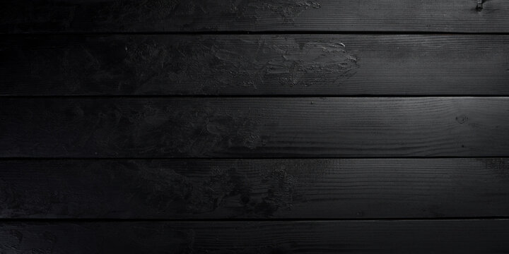 Black textured wooden background. Free space for design or text. Top views