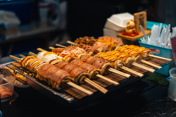 Japanese rice rolls on skewers, street food