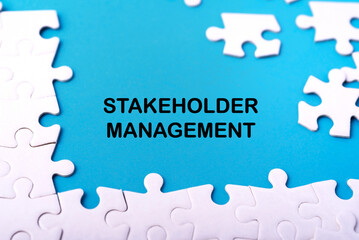 Work and management concept. STAKEHOLDER MANAGEMENT written on blue backdrop. Blurred styled...