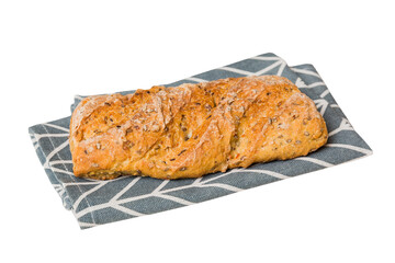 Freshly baked delicious french bread with napkin isolated on white background top view. Healthy white bread loaf