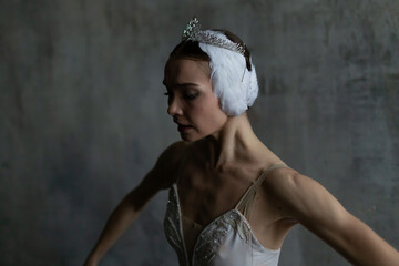 Graceful ballerina in the image of Odette from Pyotr Tchaikovsky's ballet "Swan Lake"