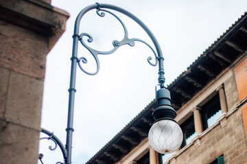 A charming photo featuring a classic street lamp, evoking nostalgia and urban ambiance with its...