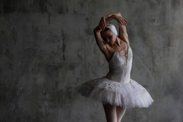 Slender beautiful ballerina performing a ballet dance.