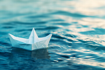 Obraz premium White paper boat on the open sea, close-up