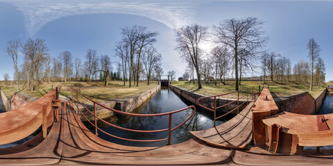 hdri 360 panorama near gateway lock construction on river, canal for passing vessels at different...