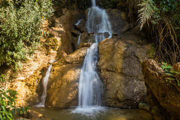 Naklejka na ściany i meble Waterfall near Donkhoun (Done Khoun) village near Nong Khiaw, Laos