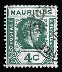 Ukraine, Kiyiv - February 3, 2024.A stamp printed in MAURITIUS shows image of the King George VI ,...