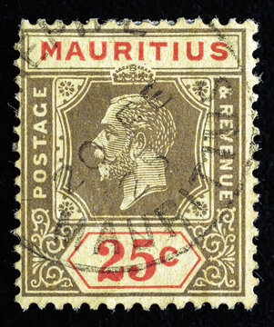 Ukraine, Kiyiv - February 3, 2024.A stamp printed in the Mauritius shows King George V, circa 1921.Philately.