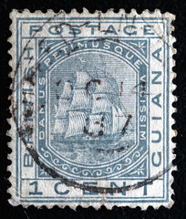 Ukraine, Kiyiv - February 3, 2024.Postage stamps from BRITISH GUIANA.An 1 cent slate postage stamp depicting the Seal of the British Crown Colony British Guiana 1876.Philately.