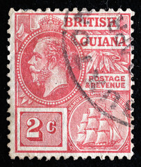Ukraine, Kiyiv - February 3, 2024.Postage stamps from BRITISH GUIANA.A stamp printed in the BRITISH GUIANA shows King George V, circa 1913.Philately.Postage stamps from different countries and times