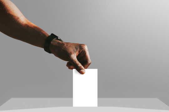 Man casting his vote to a ballot box mockup