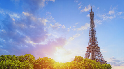 Paris Eiffel tower in France, isolated on blue sky. Travel landmark, copy space.