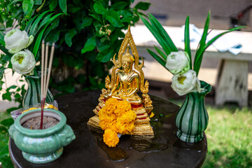 Background of Buddha statues used in the Buddha bathing ceremony on Songkran Day or making merit at...