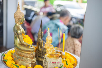 Background of Buddha statues used in the Buddha bathing ceremony on Songkran Day or making merit at...