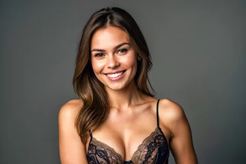 Poster Stunning woman wearing beautiful lingerie smiling while looking at the camera on a clean background © The A.I Studio