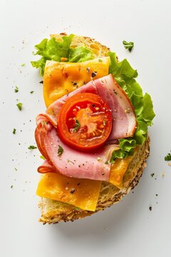COMMERCIAL FOOD PHOTOGRAPHY, half of a spongy briollo bread with ham, lettuce and tomato with cheese, isolated on a white background