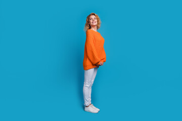 Full length photo of cheerful lovely nice woman wear trendy orange clothes look empty space...