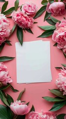 Blank square card surrounded by pastel colored flowers on a light pink background
