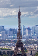 PARIS, FRANCE - MARCH 30, 2024: Eiffel Tower and La Defense business district seen from Montparnasse Tower