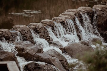 waterfall in the forest vintage film water flowing over rocks