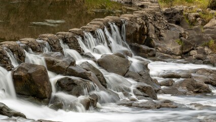 waterfall in the forest long exposure flowing over rocks