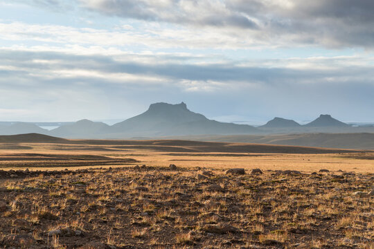 View of Wide uninhabited landscape with mountains of Jarlhettur in front of Langjokull glacier, highlands of Iceland. - Powered by Adobe