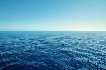 A photo featuring a vast body of water with a clear blue sky stretching across the horizon, An endless blue ocean under a clear day sky, AI Generated - Powered by Adobe