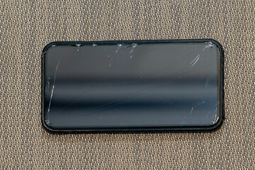 Broken mobile phone glass display with visible cracks - 788205945