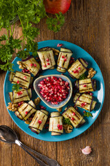 Delicious appetizer of grilled eggplants. Wrapped in rolls with nut paste. Served with pomegranates. - 788206932