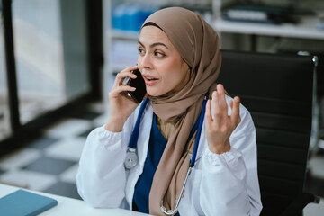 Female medicine doctor, physician or practitioner involved in cellphone call conversation giving professional consultation to patients. Medic tech concept.