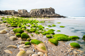 Beautiful seaside landscape on the Atlantic Ocean in France, sandy beach with stones.