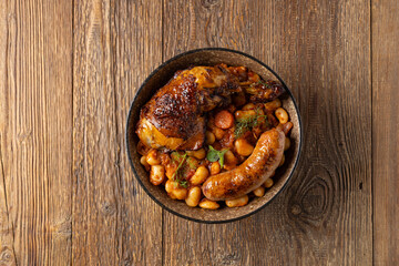 A traditional French one-pot dish with beans, chicken and white sausage. Cassoulet. - 788207535