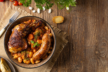 A traditional French one-pot dish with beans, chicken and white sausage. Cassoulet. - 788207754