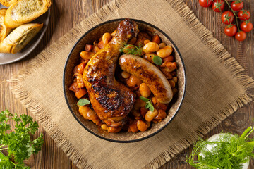 A traditional French one-pot dish with beans, chicken and white sausage. Cassoulet. - 788207757