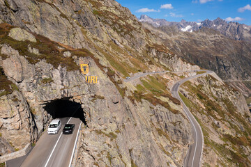 Sunsten Pass, Switzerland: Cars drive through a tunnel along the Susten pass mountain road between...