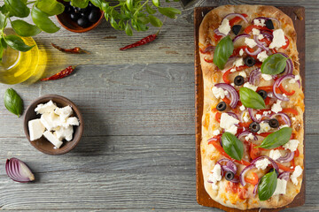 Traditional Roman pinsa with feta cheese, peppers and black olives. - 788210156