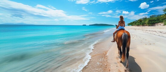 Woman horseback riding on stunning tropical beach paradise under clear blue skies