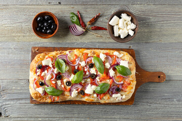 Traditional Roman pinsa with feta cheese, peppers and black olives. - 788210165