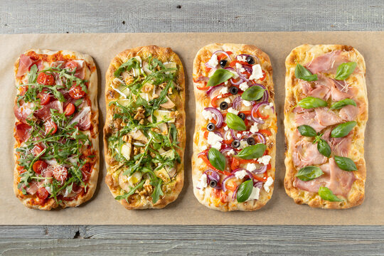 Traditional pinsa with 4 flavors. View from above. Top view.