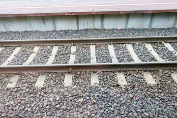 Close Up of a Train Track With Gravel - obrazy, fototapety, plakaty