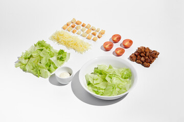 Deconstructed Caesar salad ingredients with neat geometry isolated on white background - obrazy, fototapety, plakaty