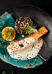 Exquisite Salmon Steak with Caviar Sauce and Brown Rice Dish on Stylish Plate - 788216923