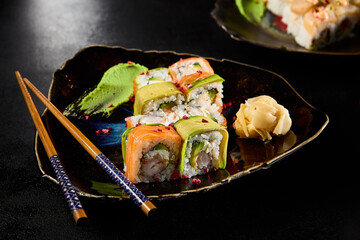 Sushi Delight: Salmon, Shrimp, and Avocado Roll on Elegant Plate - 788217526